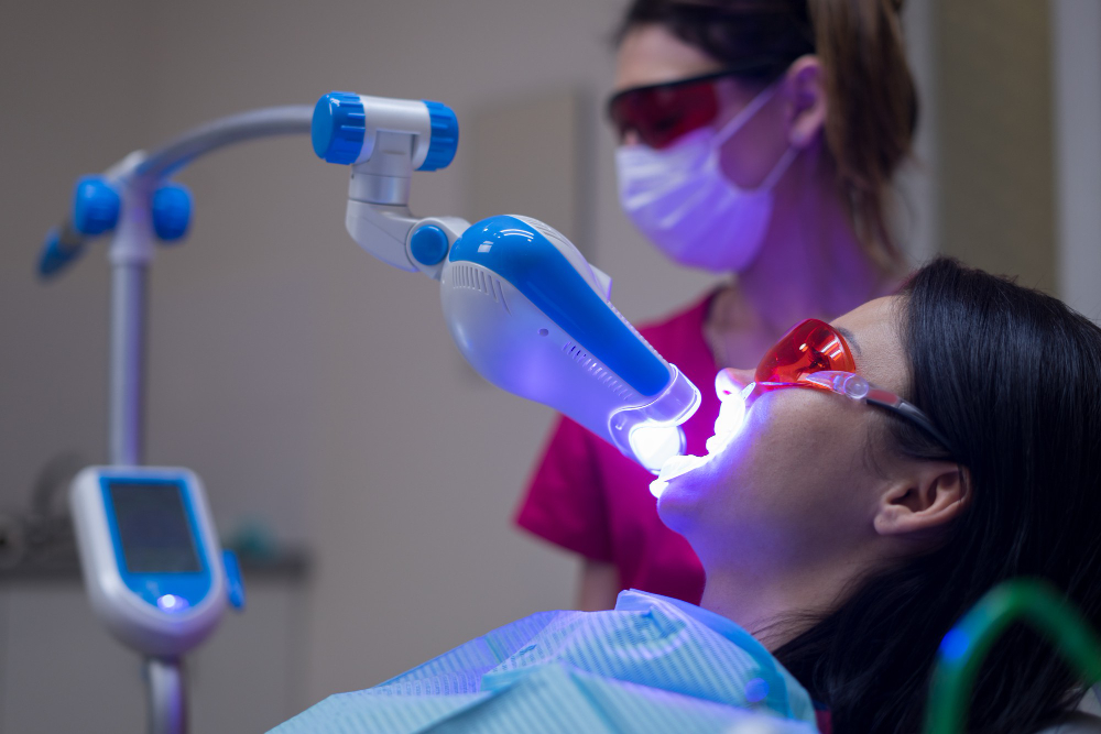 teeth-whitening-procedure-with-ultraviolet-light-uv-lamp.jpg