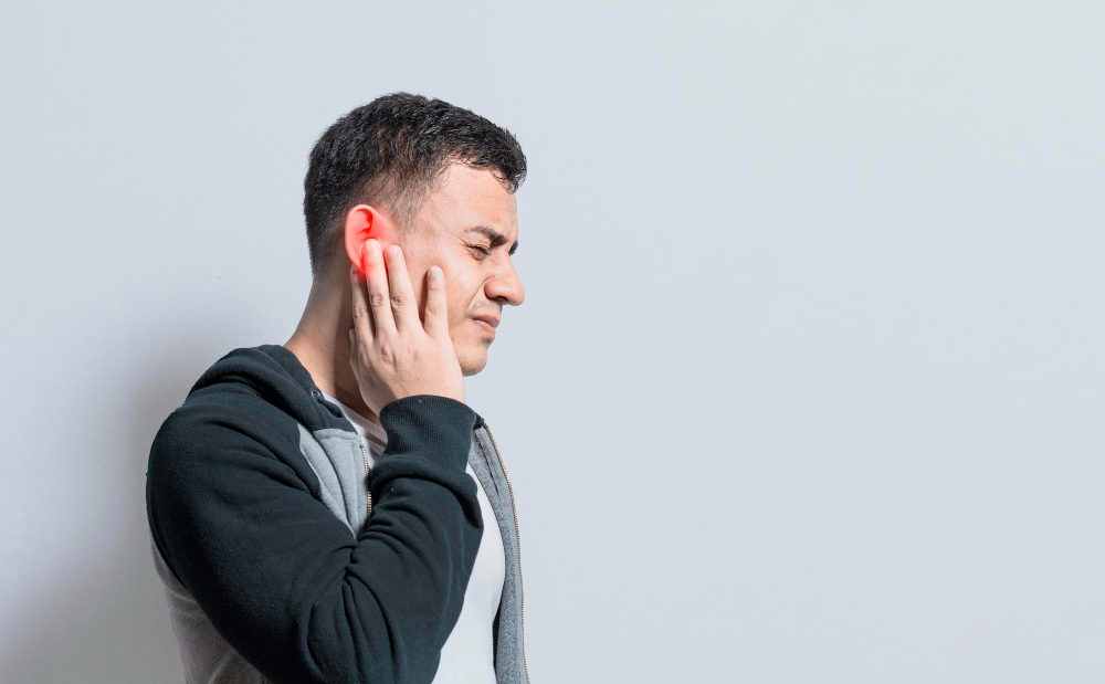 person-with-otitis-tinnitus-person-with-ear-pain-isolated-background-suffering-man-massaging-his-ear-isolated.jpg